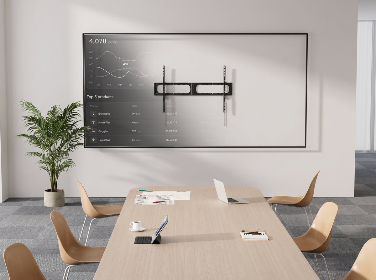 Low-profile fixed TV wall mount in a boardroom