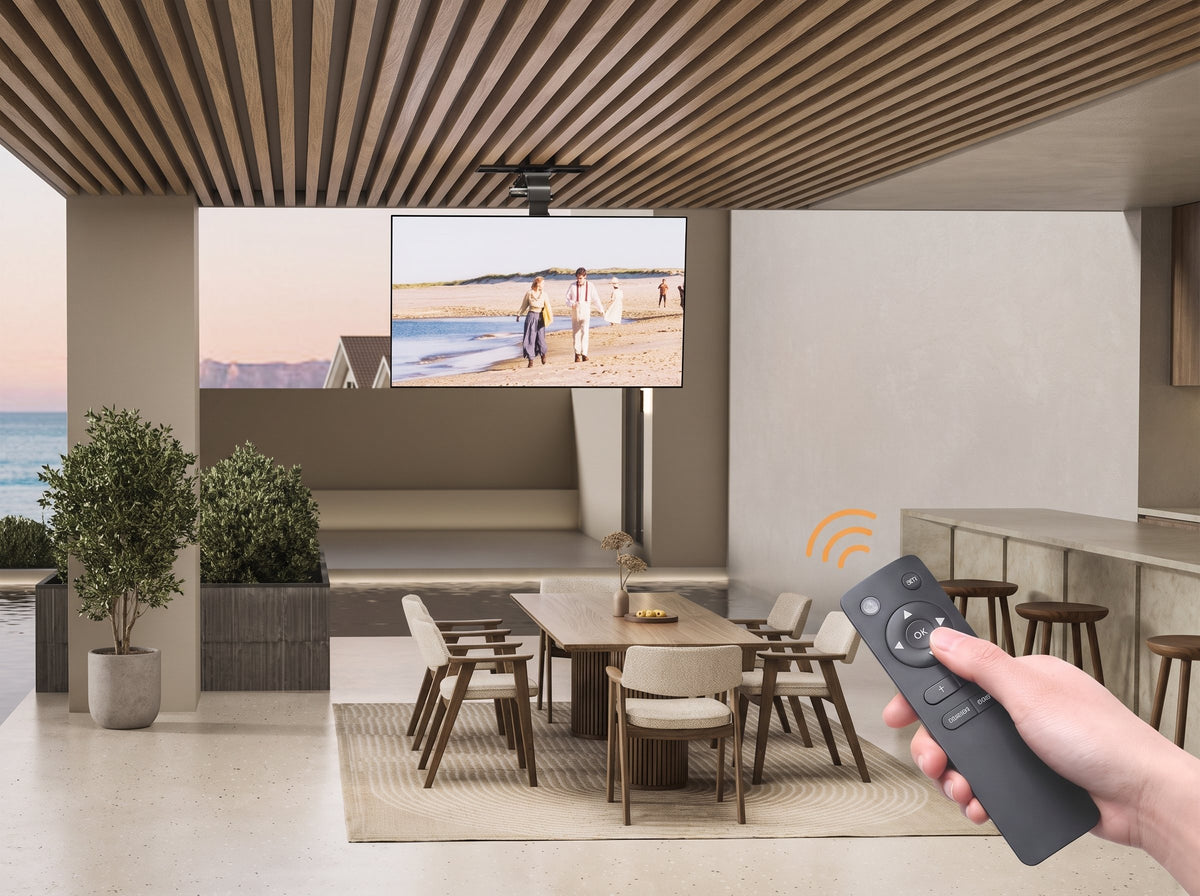 Motorized ceiling-drop TV mount in an outdoor dining space