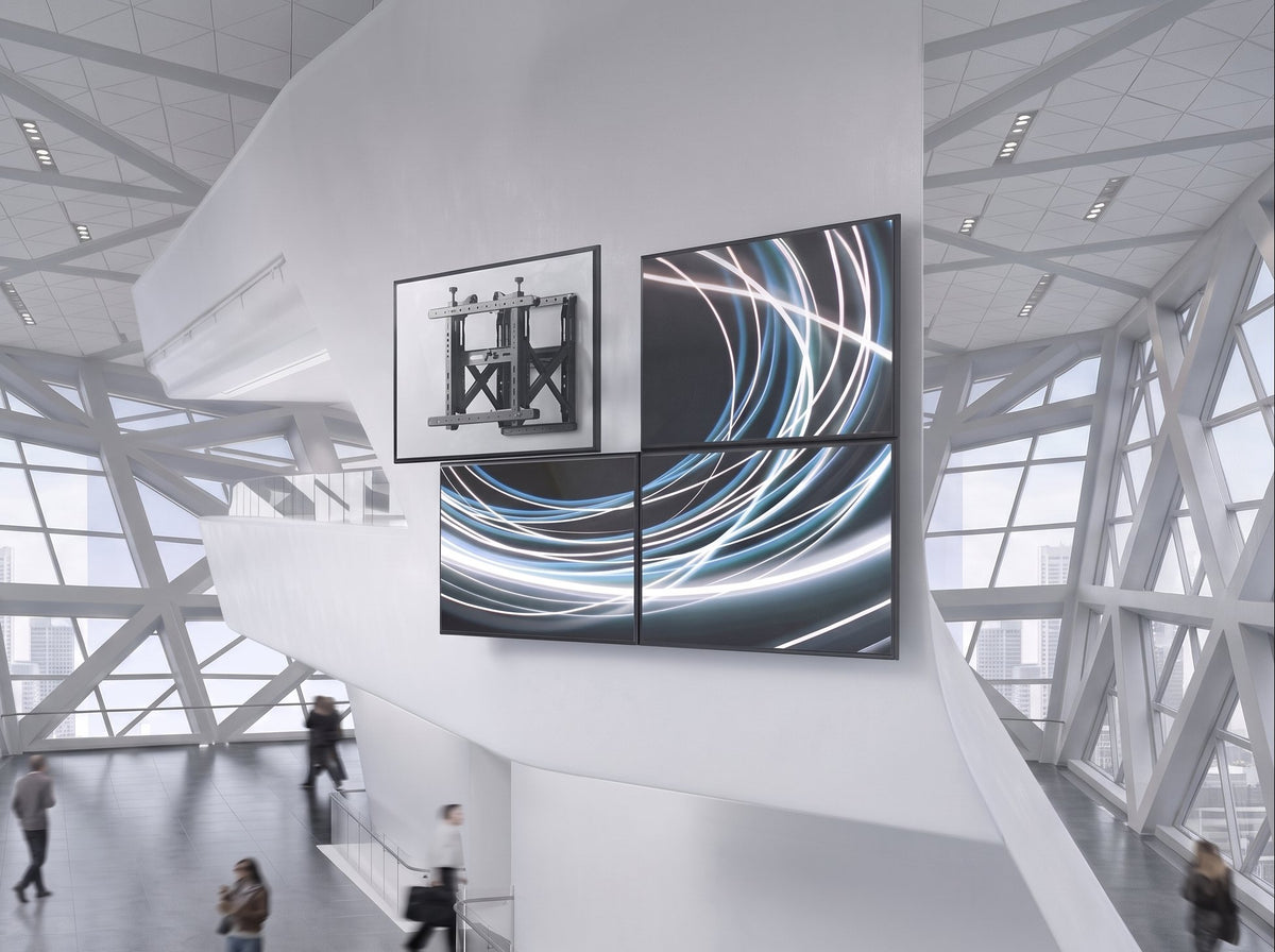 Push-pull video wall mount installation in a modern glass lobby