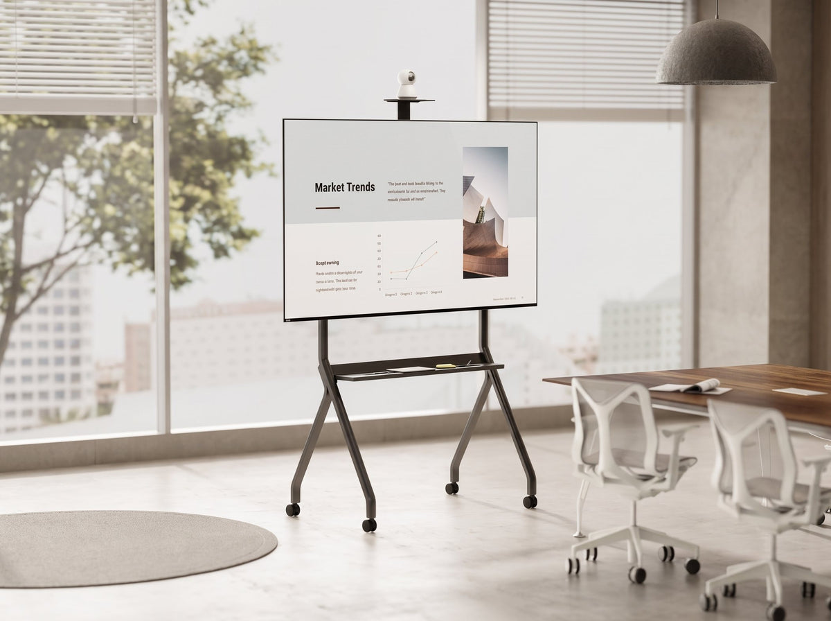 Mobile TV cart with rolling floor stand in a modern office meeting room
