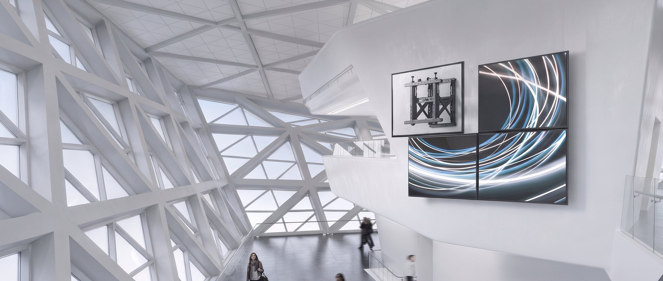Video wall mount installation in a modern glass lobby