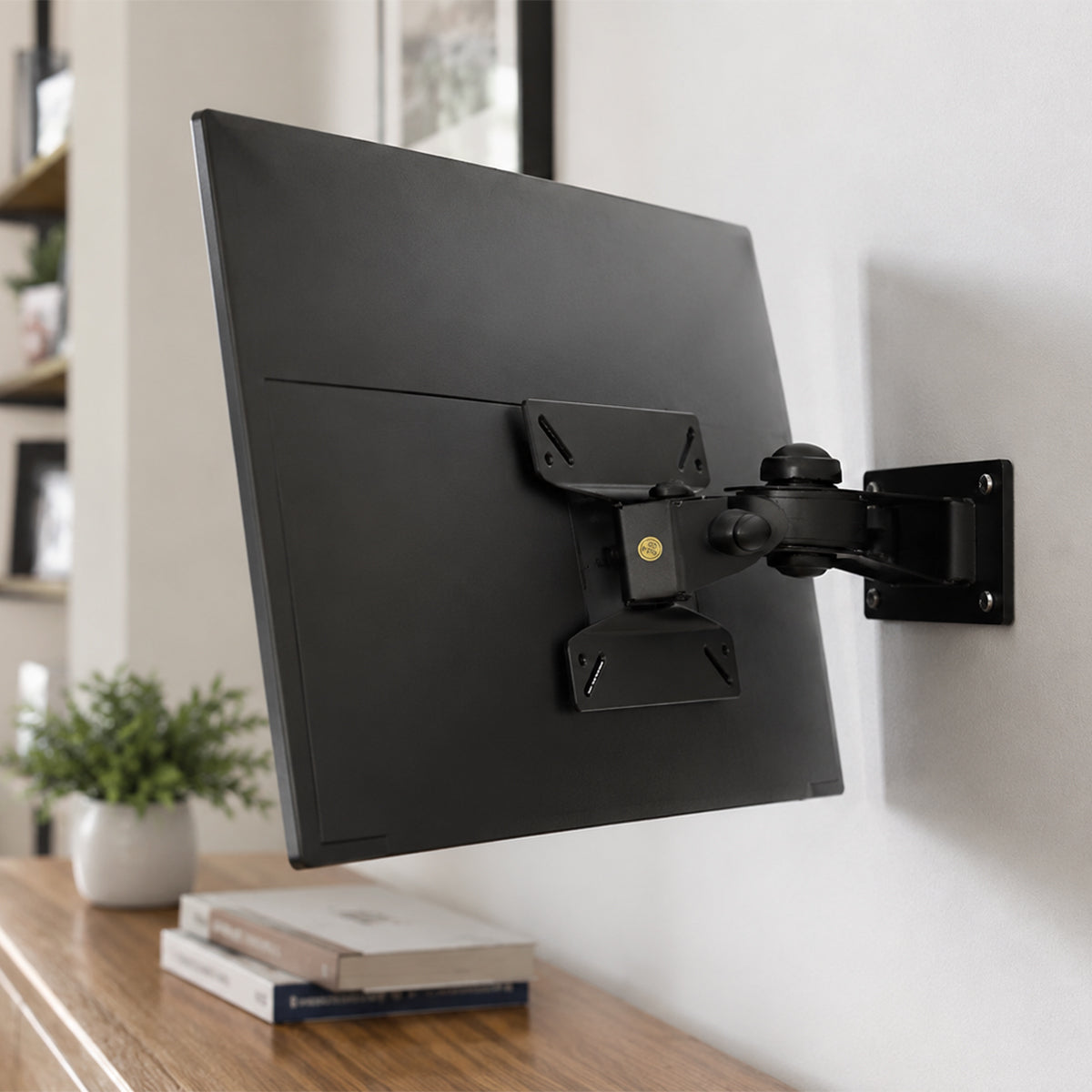 SH-10P full-motion TV wall mount installed behind a mounted TV